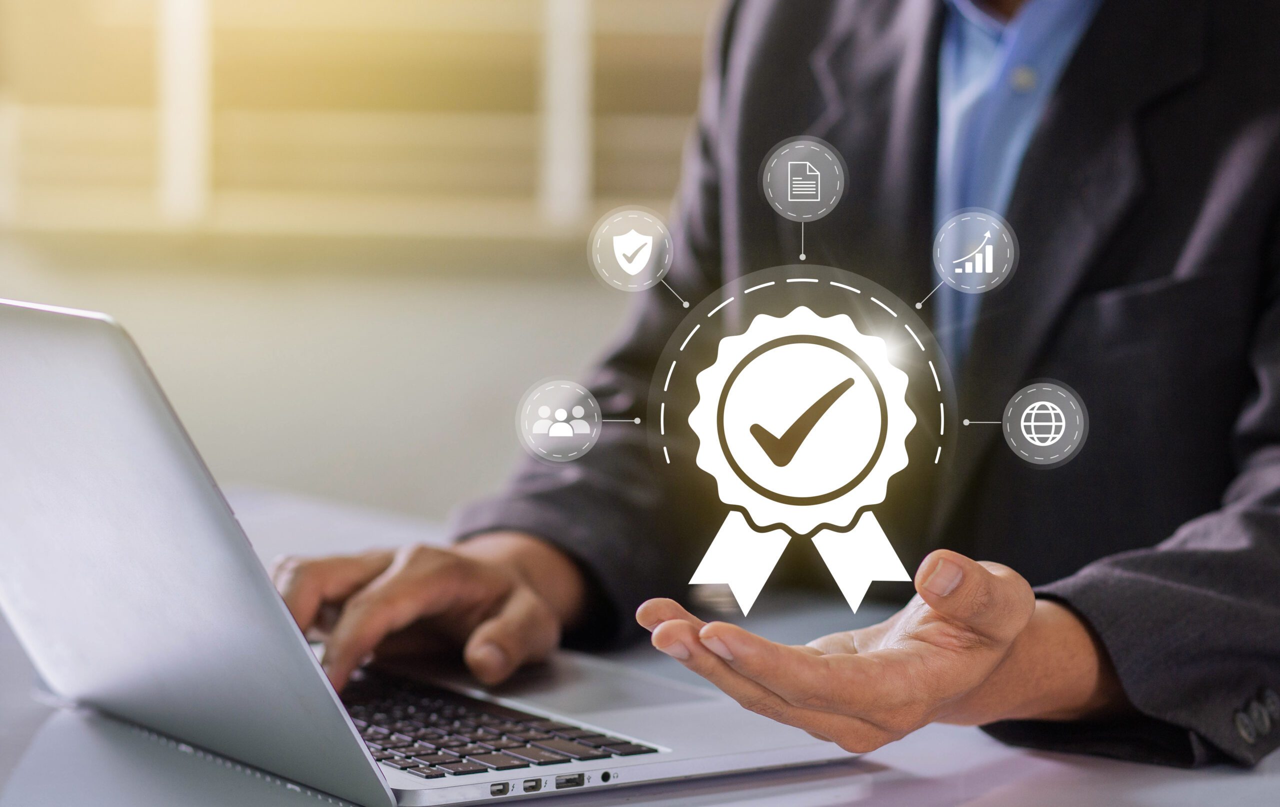 Businessman working on labtop with check mark symbol and standar