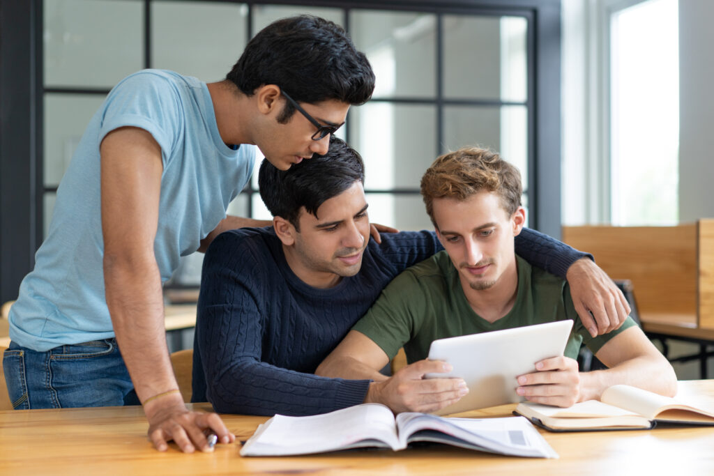 Group friends studying together, helping each other